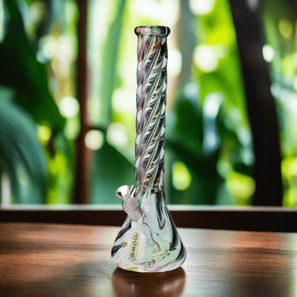 Iridescent glass bong on a wooden table, available at Discreet Smoker’s online head shop.