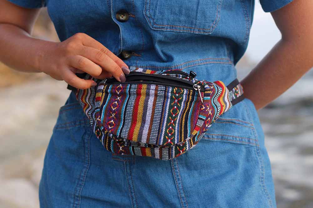 model unzipping boho fanny pack