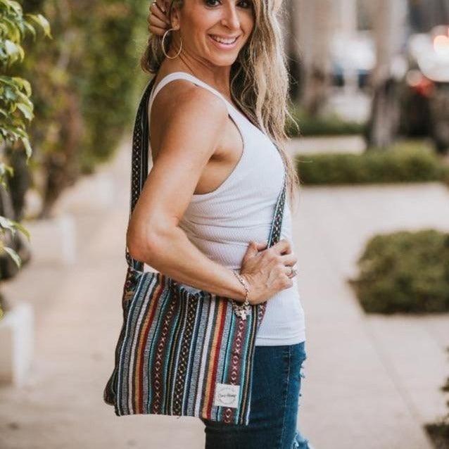 boho messenger bag with woman in park