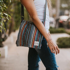 boho messenger bag with woman in park