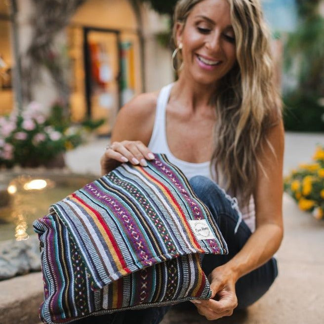 boho messenger bag with woman in park